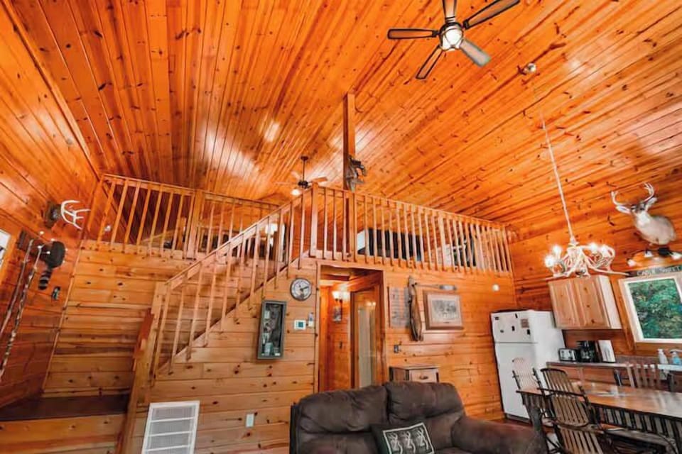 Great Room: Experience rustic charm with high ceilings, wood accents, and inviting natural light!