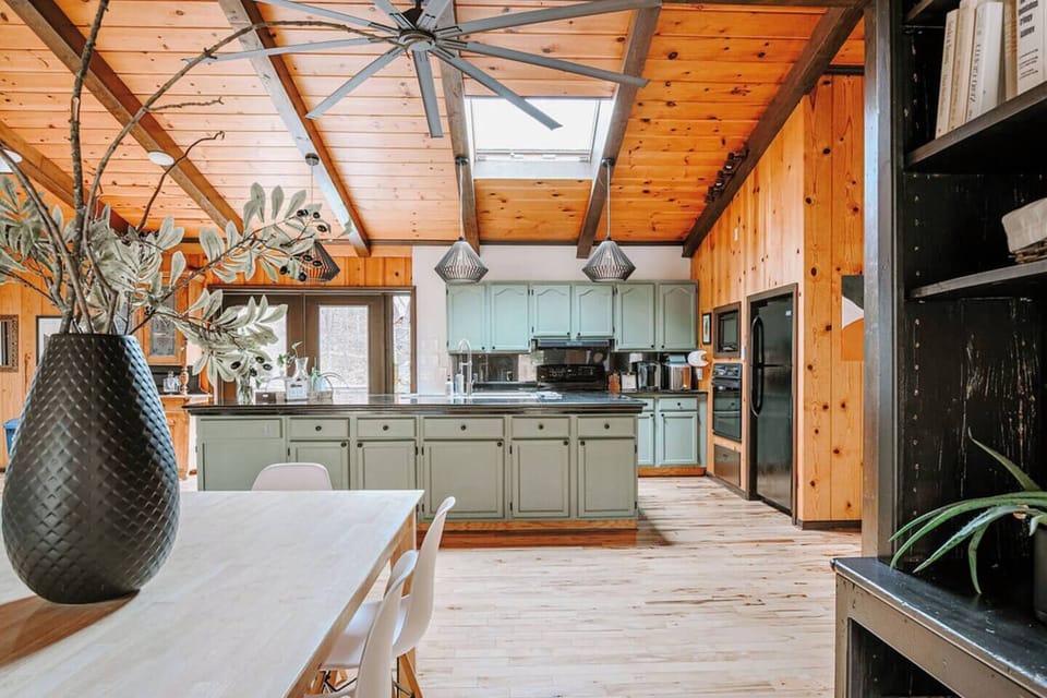 Bright, spacious kitchen with a large island and beautiful wood accents.