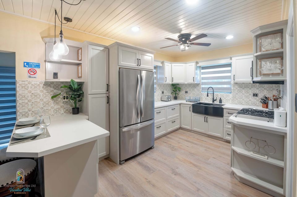 Fully equipped with cookware, bakeware, blender, toaster, and dining table