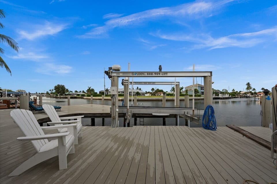 Private waterfront dock with boat lift and relaxing canal views