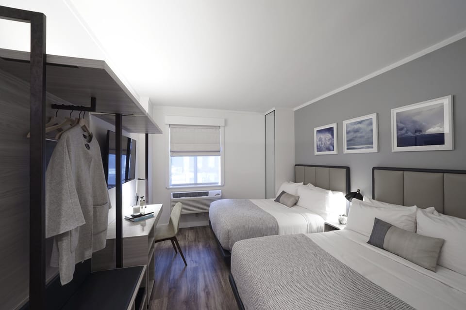 Premier Room with Two Double Beds | Hypo-allergenic bedding, down comforters, in-room safe