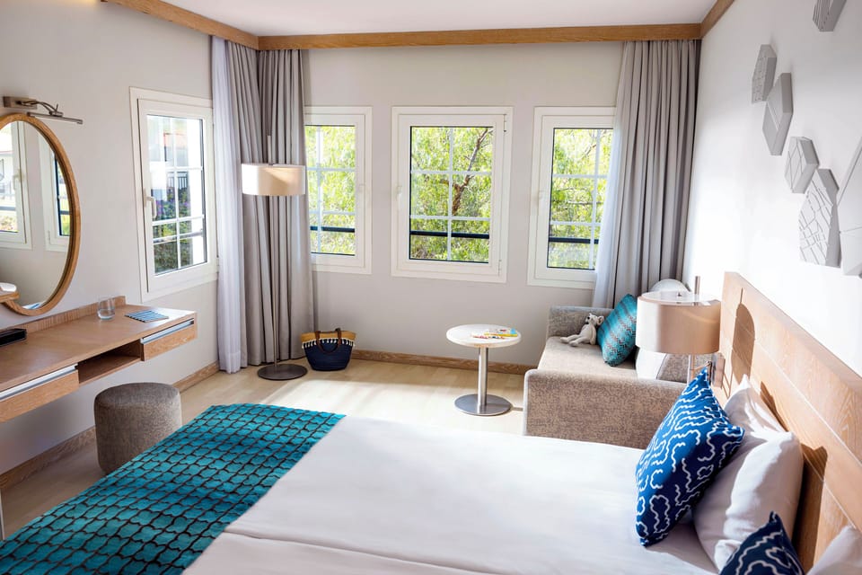 Premium bedding, down comforters, Tempur-Pedic beds, minibar