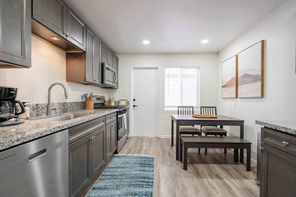 Fully equipped kitchen and café-style dining area for easy meals at home.