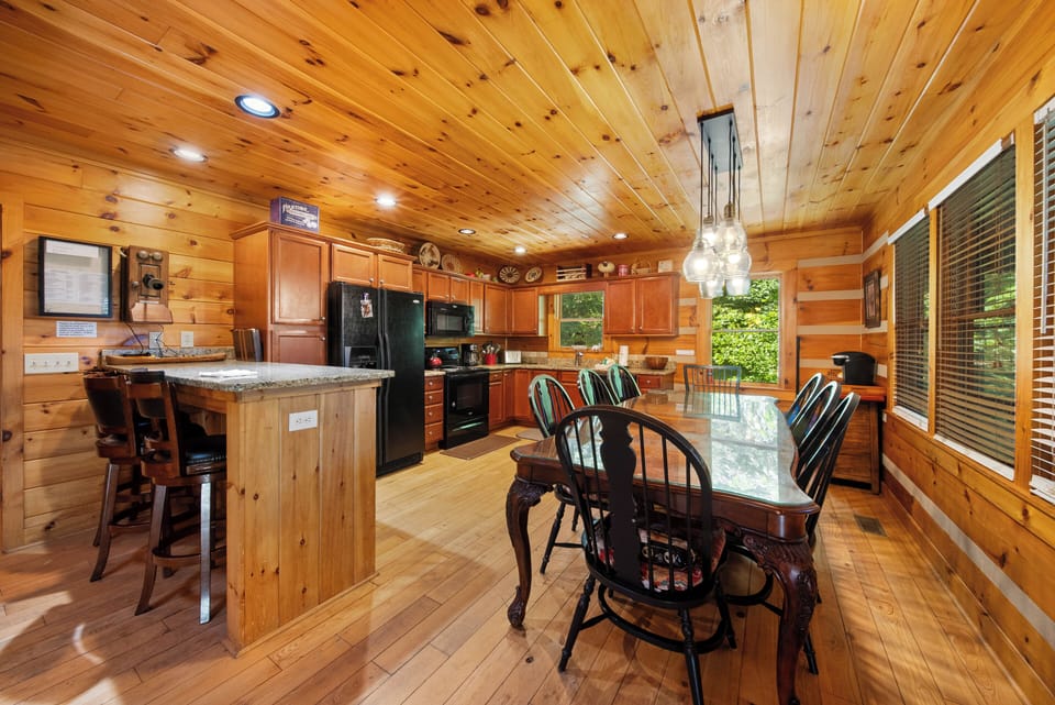 Kitchen and Dining with Additional Seating at the Bar