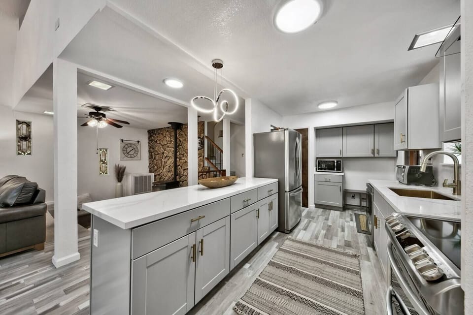 Prepare your favorite meals in the fully equipped kitchen with modern appliances, generous counter space, and everything you need for a comfortable mountain stay.
