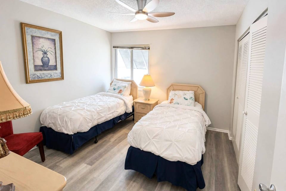 Cozy guest bedroom with twin beds, perfect for kids or additional guests.