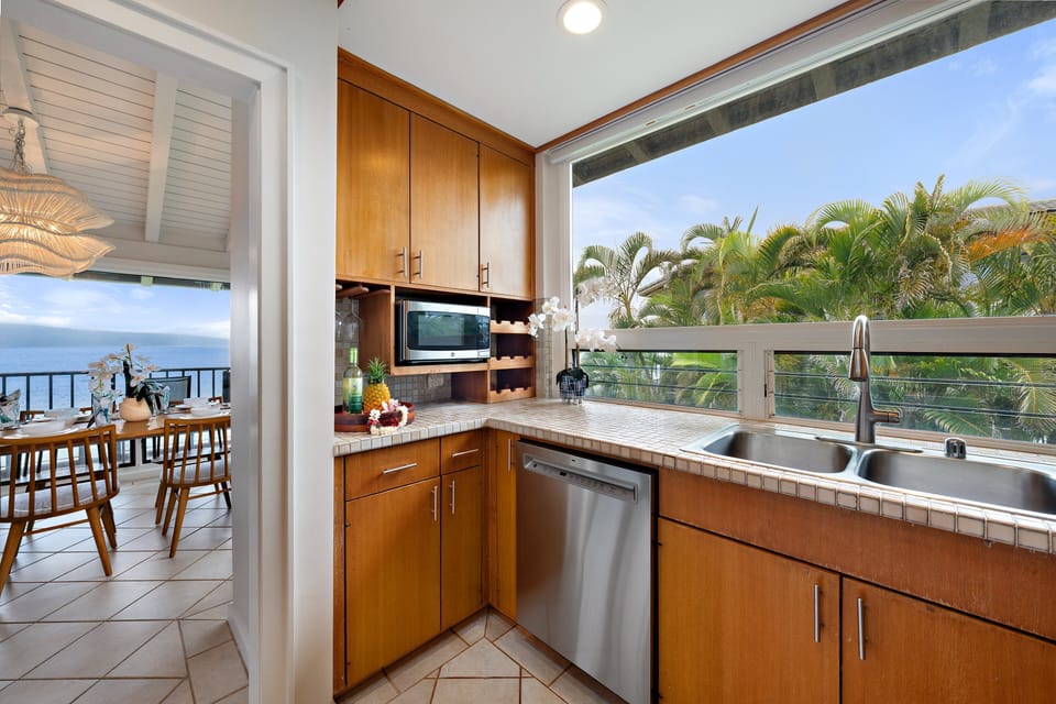 Wake up to spectacular ocean views from the king-bed primary suite with direct access to a private furnished lanai.