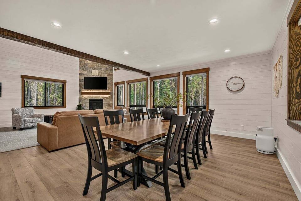 Spacious dining area with seating for ten and beautiful forest views.