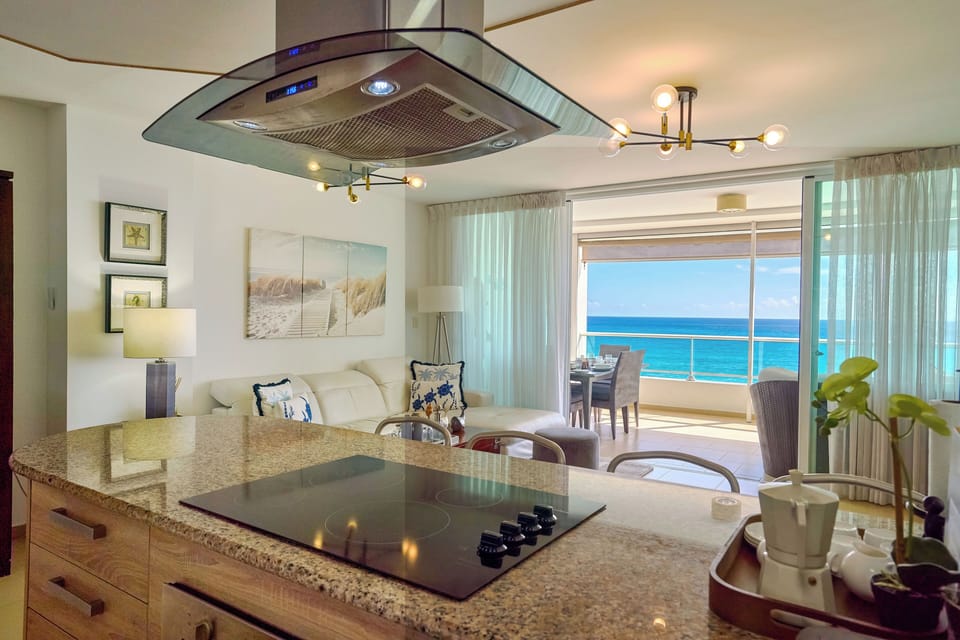 Beachfront Living Room – Relax with A/C, Smart TV, and ocean views — your cozy corner by the beach.