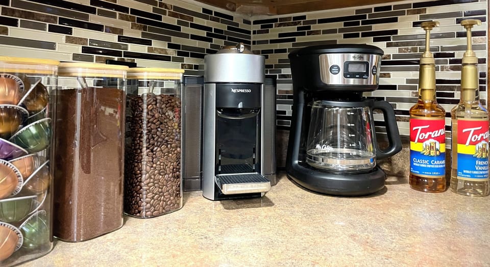 Build your perfect morning cup ☕ with both Nespresso and drip coffee makers, pods, fresh beans, flavor syrups, and sweeteners ready to enjoy.