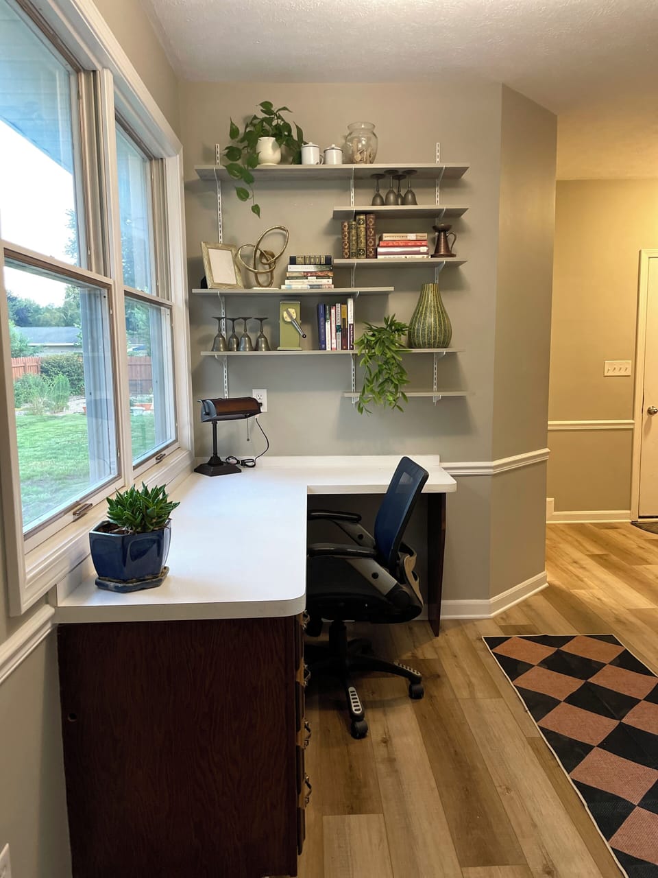 Stay productive at the dedicated window-side workspace 💻, complete with a comfortable office chair, long desk, and shelves for your essentials.
