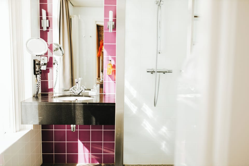 Designer toiletries, hair dryer, towels, soap