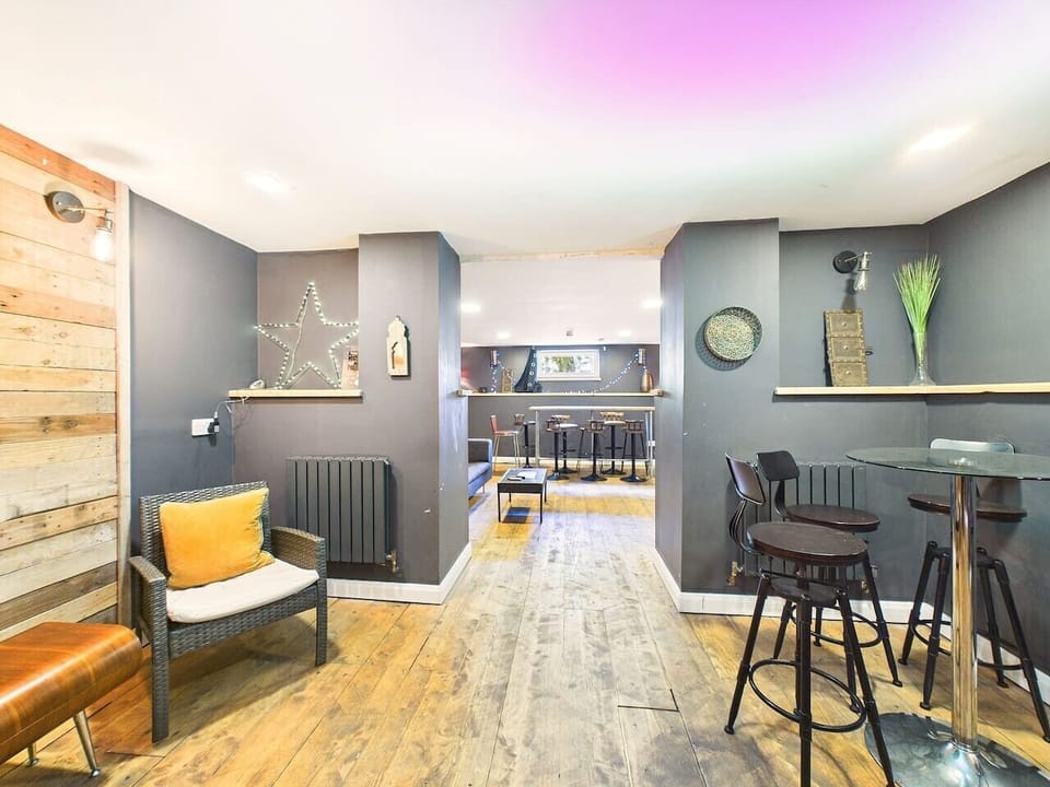Perch at the reclaimed-timber bar with a drink in hand while the games carry on around you.