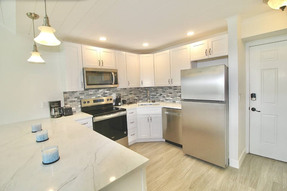 The Kitchen offers new stainless steel appliances and gorgeous quartzite counters, to prep, cook and dine.