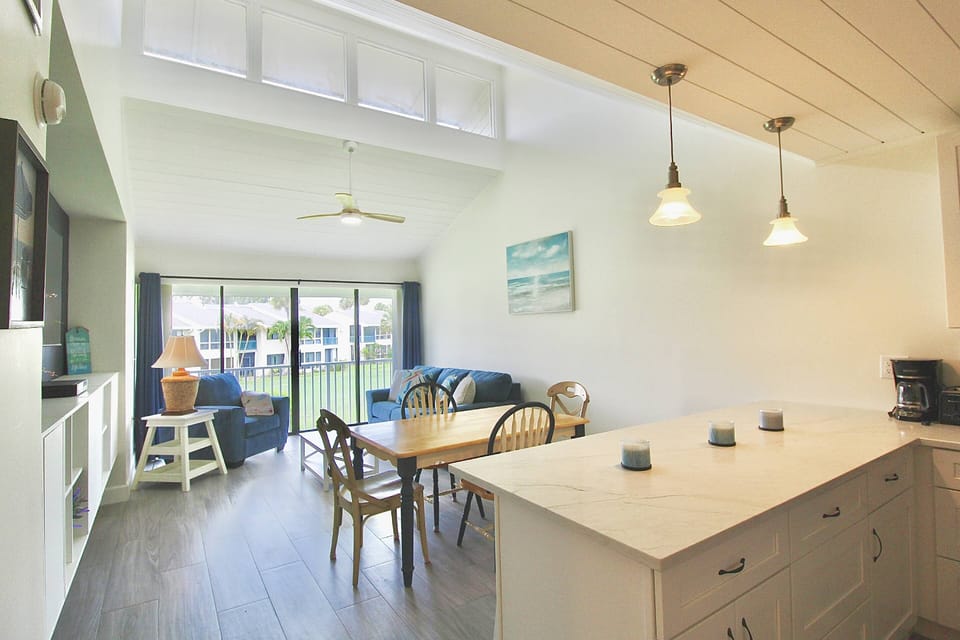 The Gorgeous open floor plan boasts high skylight ceilings, plenty of space to gather together and new tile flooring throughout.