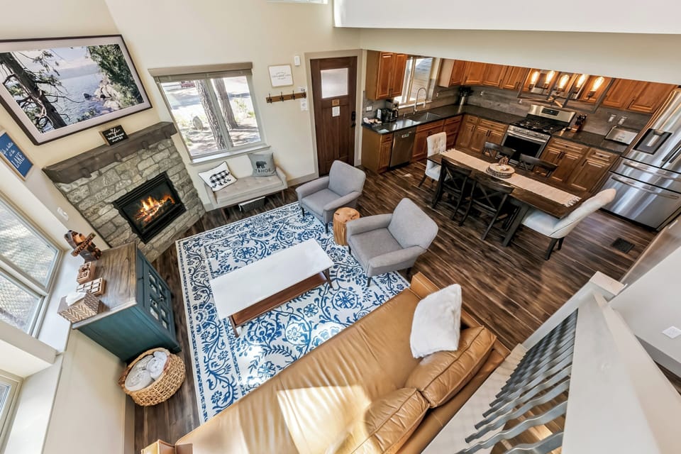 Relax in your open-concept retreat with vaulted ceilings, a cozy stone fireplace, and a fully equipped kitchen—perfect for unwinding after a day of adventure.