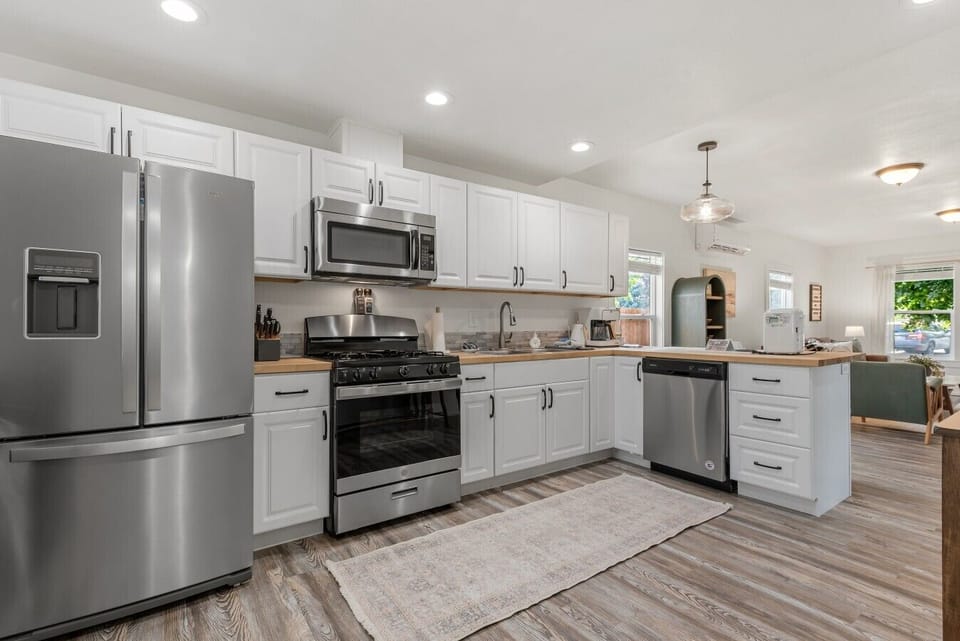 Brand new appliances including a gas stove and dishwasher.