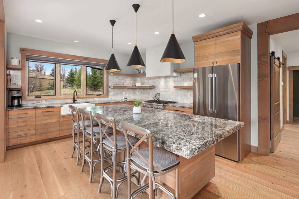 Cook together around the oversized island with modern appliances.