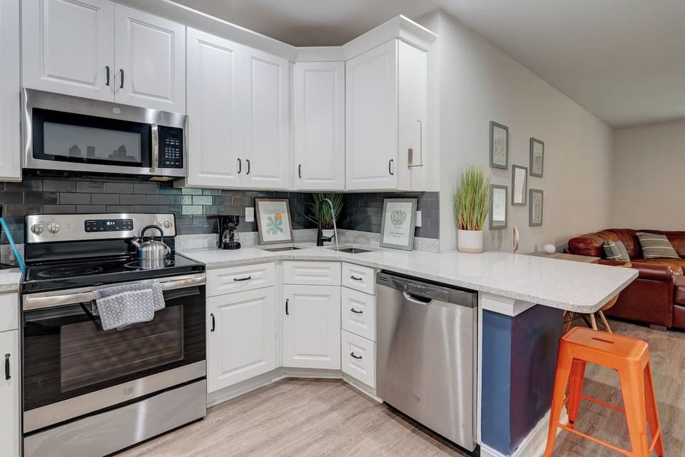 New Stainless Appliances, complete with filtered water in a french door refrigerator, allow you to cook to your hearts content. Columbian coffee, coffee pot, filters, and a full suite of pots/pans/cutting board/knives await you...