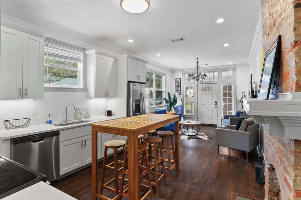 Well-equipped kitchen with stainless steel appliances, ample cabinetry and counter space, plus a spacious island for dining and meal prep.