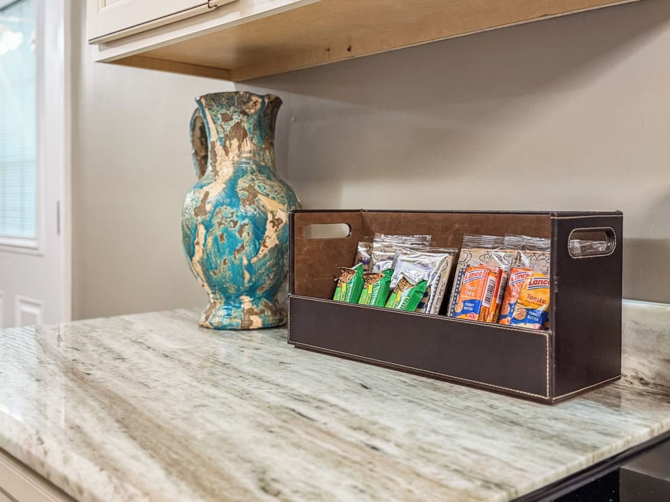 Welcoming snack station on a sleek stone countertop