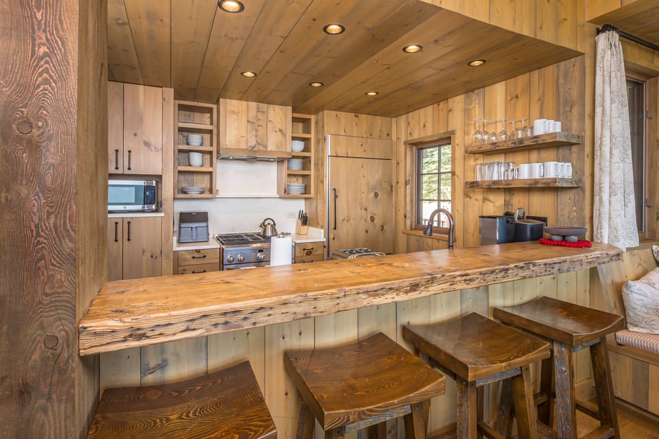 Rustic kitchen with live edge bar | Main Level