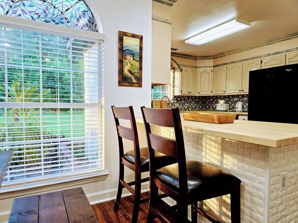 Welcome the morning with your favorite cup of joe or gather with family in this warm dining area full of natural light.
