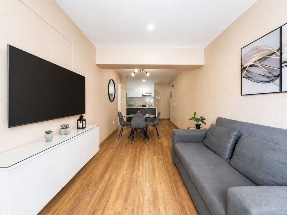 Apartment, 1 Queen Bed with Sofa bed, Private Bathroom | Living room | 50-inch Smart TV with digital channels, Netflix, streaming services