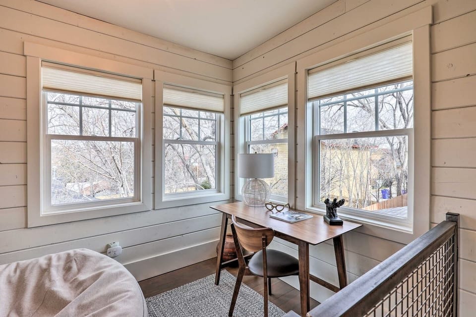 Wraparound windows flood this workspace with natural light, making it easy to stay productive on the road.