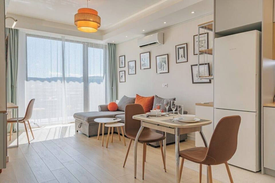 Living room with a set dining table, ready for a meal.