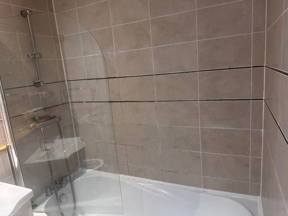 Separate tub and shower, deep soaking tub, towels