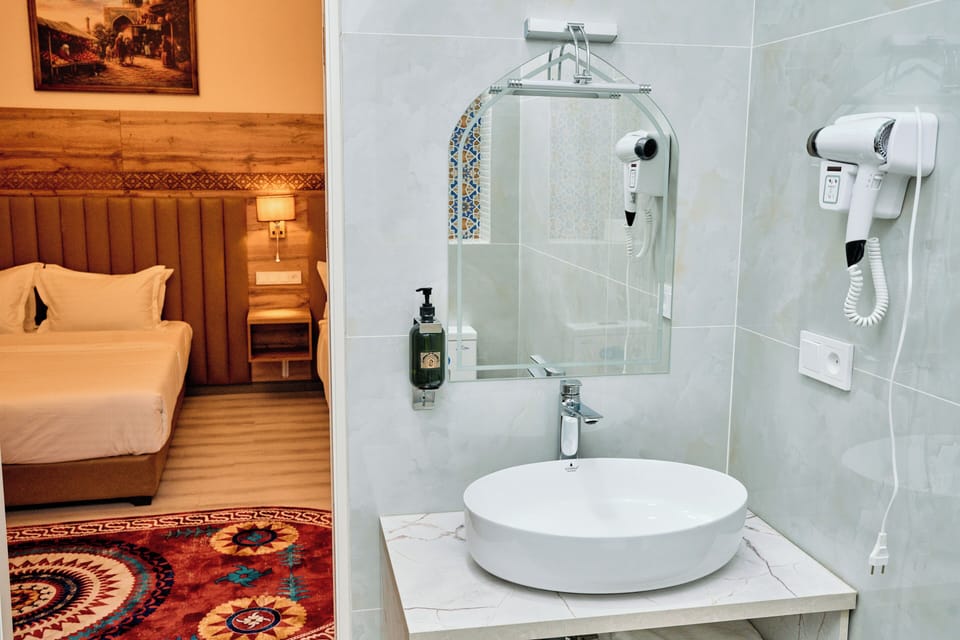 Family Triple Room, Balcony | Bathroom | Shower, hair dryer, slippers, towels