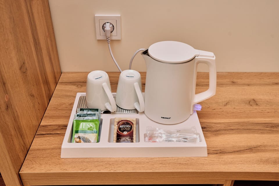Family Triple Room, Balcony | Coffee and/or coffee maker