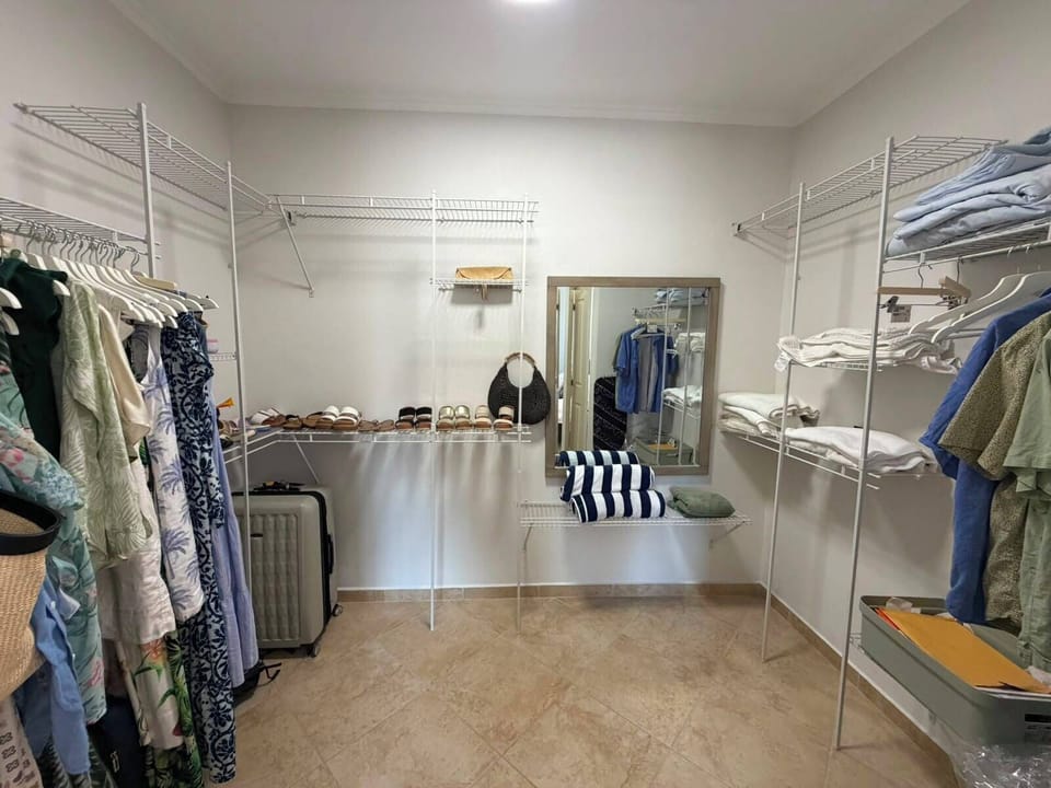 Unpack and settle in with ease using our massive walk-in closet with custom shelving and ample storage.