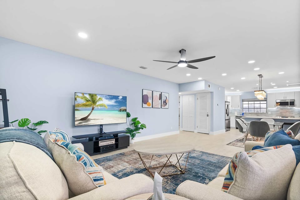 Spacious living room with comfortable seating and a Smart TV.