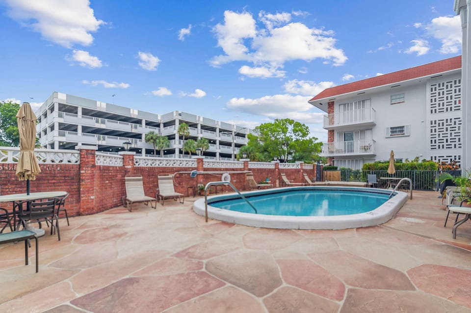 Shared outdoor pool for a refreshing swim and relaxing by the water.