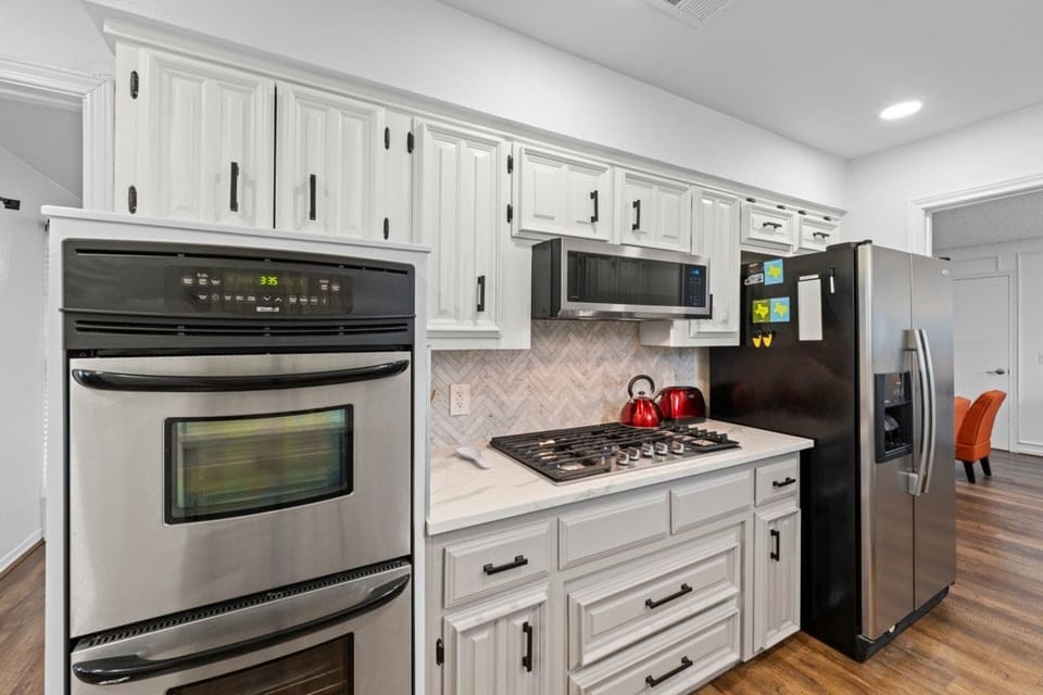 Prepare everything from morning coffee to family dinners in a beautifully updated kitchen designed for comfort and convenience.