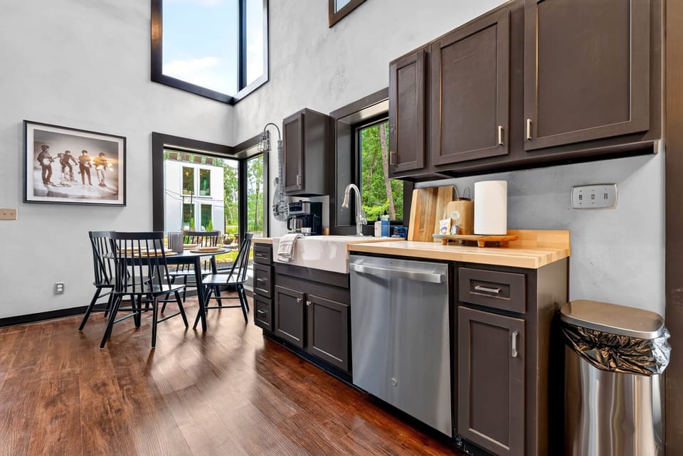 Modern kitchen stocked with cookware, dishes, and essential cooking tools