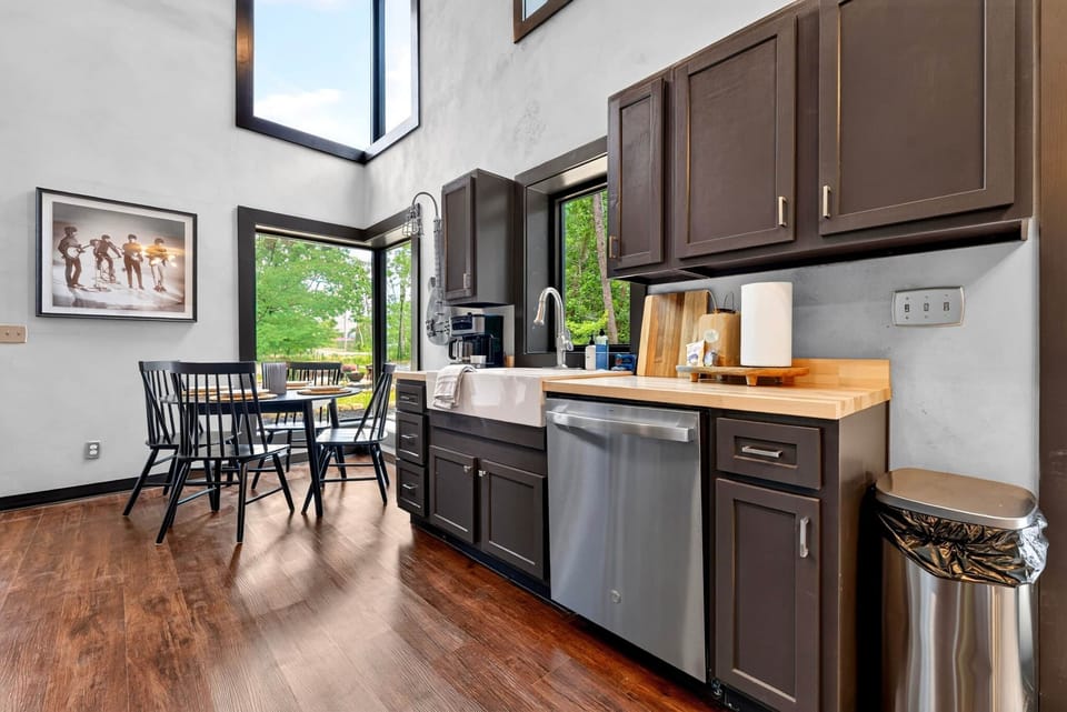 Modern kitchen stocked with cookware, dishes, and the essentials