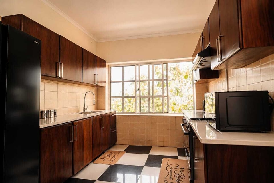 Comfort Apartment, 2 Bedrooms | Private kitchen | Full-size fridge, microwave, oven, stovetop