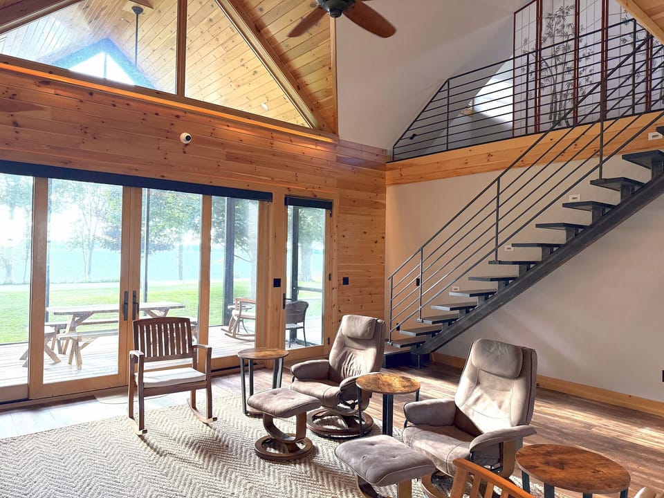 Main room and stairs to loft bedroom and game room