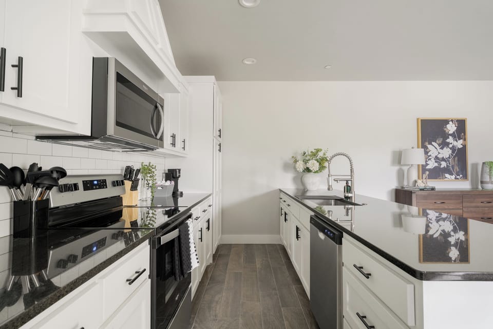 Bright modern kitchen with stainless appliances and spacious counters