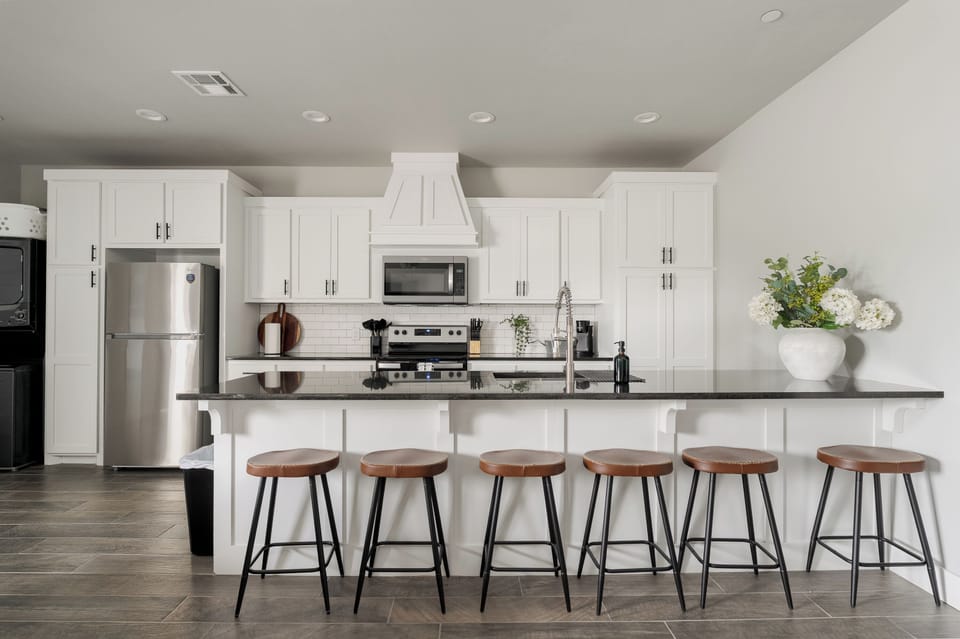 Bright modern kitchen with oversized island seating for 6