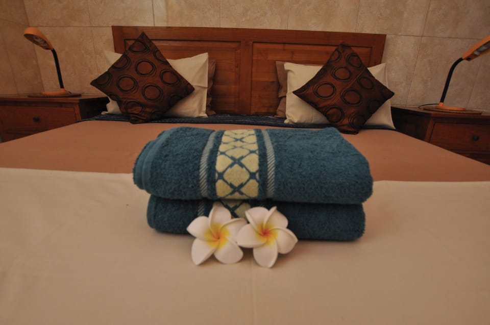 Superior Room, 1 Bedroom, Partial Ocean View, Garden Area | In-room safe, laptop workspace, bed sheets