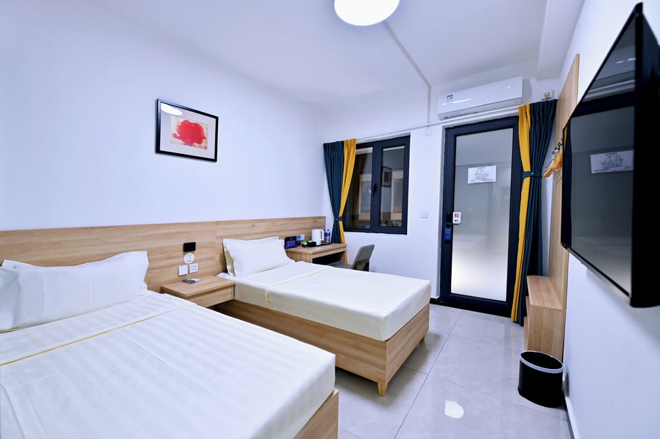Economy Twin Room | Desk, laptop workspace, blackout drapes, iron/ironing board (on request)