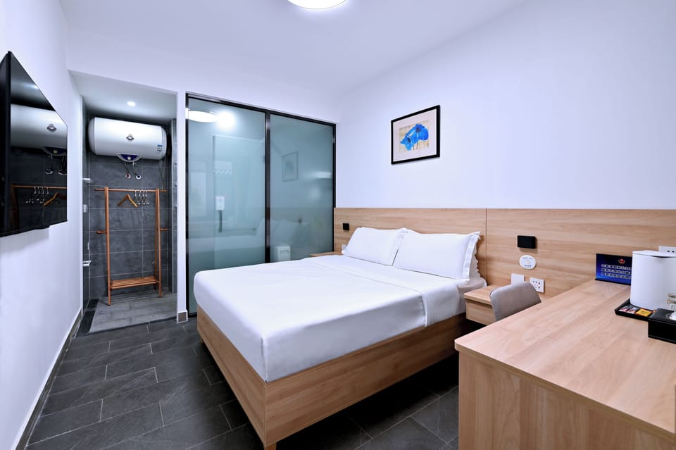 Economy Double Room | Desk, laptop workspace, blackout drapes, iron/ironing board (on request)