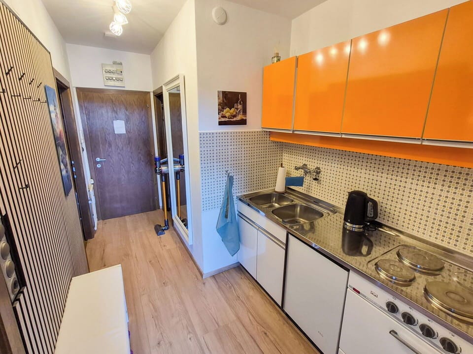 Kitchen, Major Appliance, Flooring, Countertop, Wood, Interior Design, Kitchen Appliance, Floor, Furniture, Cabinetry