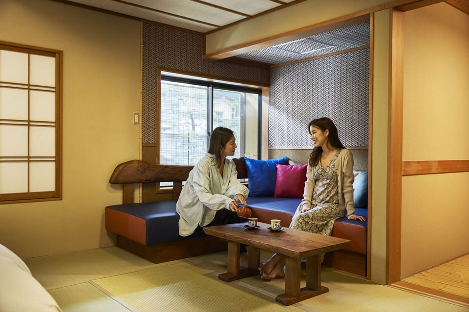 Japanese-Style Twin Room with private indoor hot spring | Living area | 30-inch LCD TV with digital channels, TV, DVD player