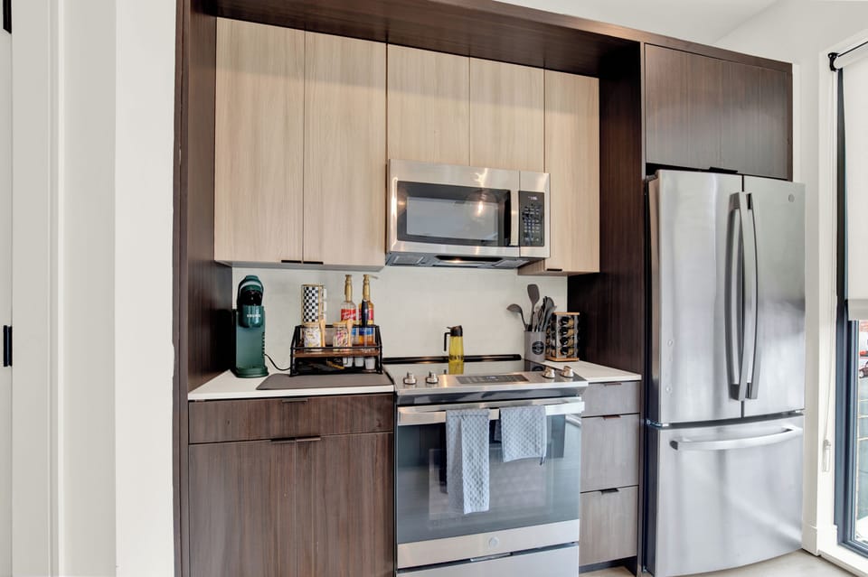 Modern kitchen with stainless steel appliances and handy coffee station