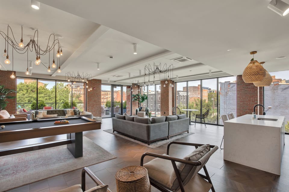Bright designer loft with city views, pool table, and stylish open living